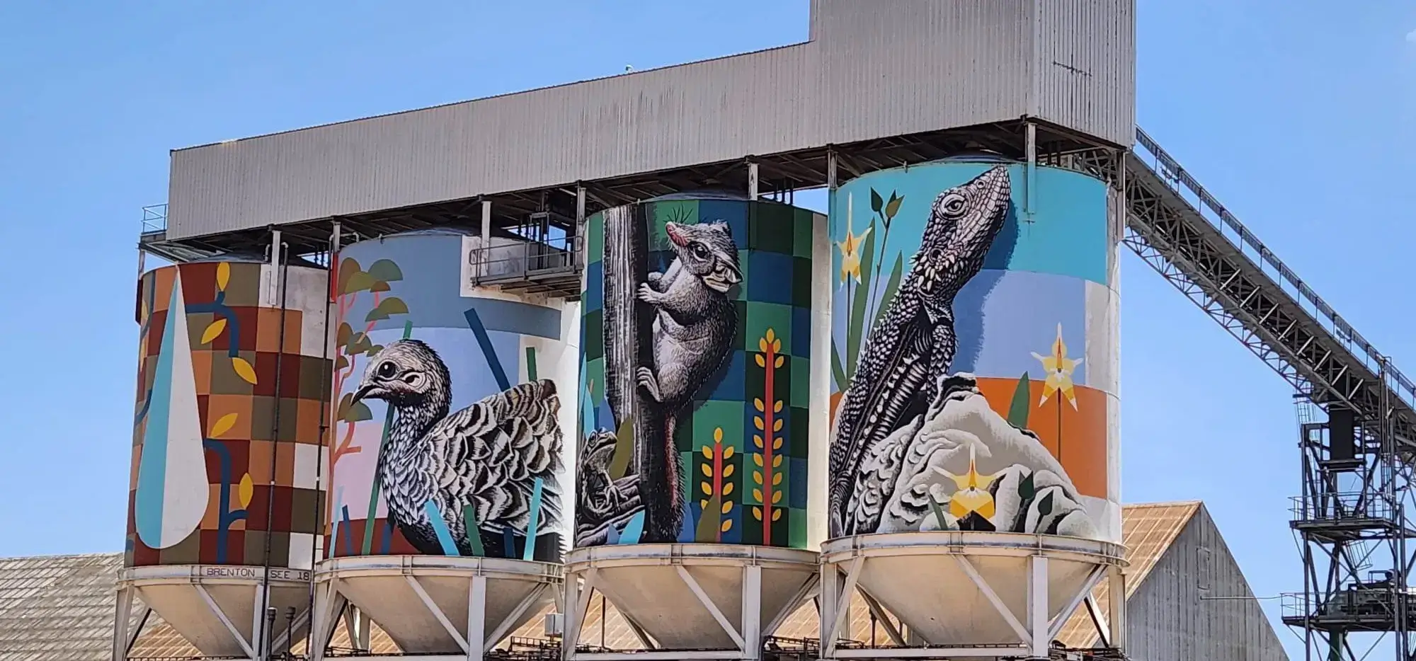 Wide angle of painted silos